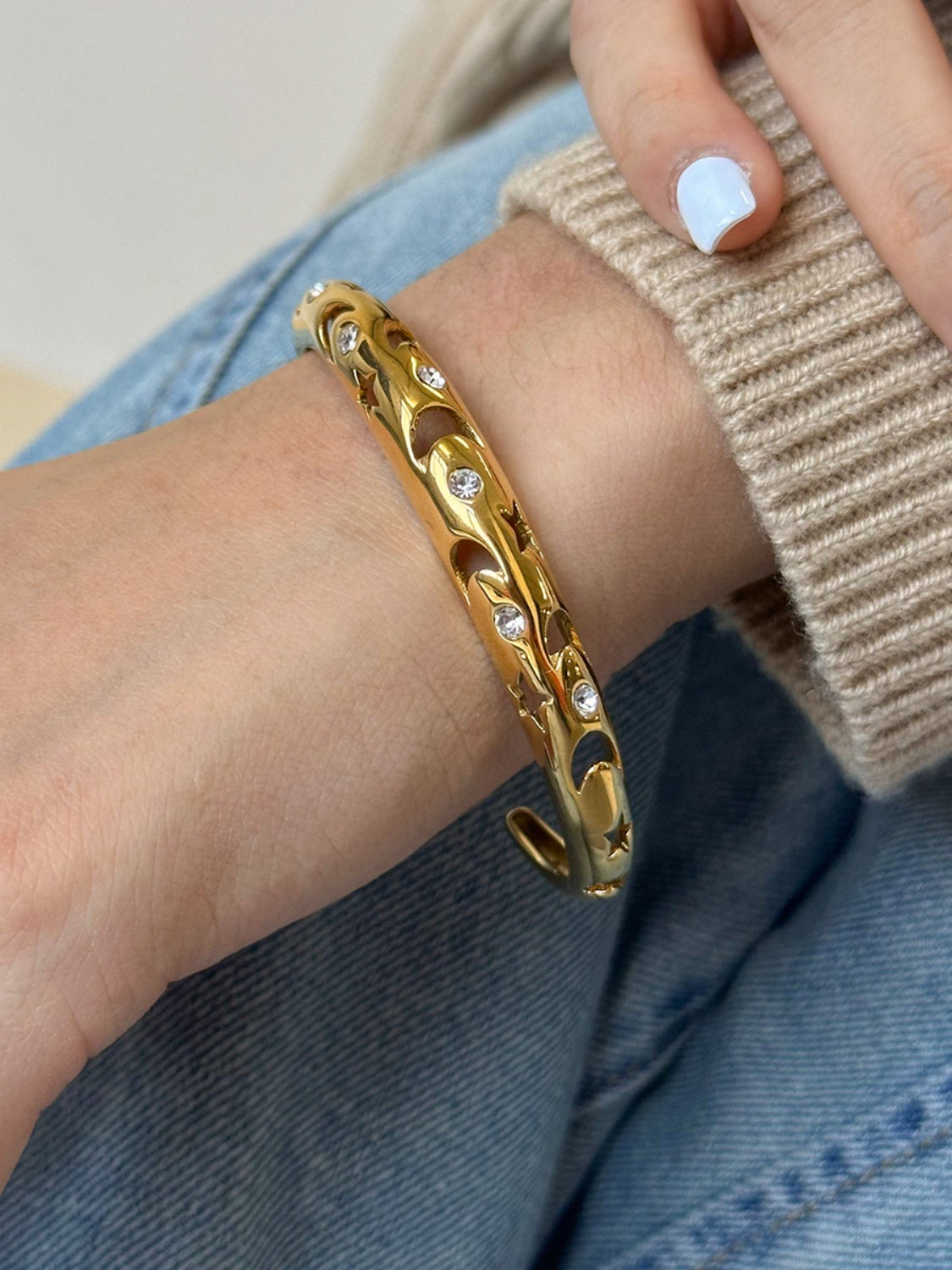 Polsino in acciaio con ritagli e strass