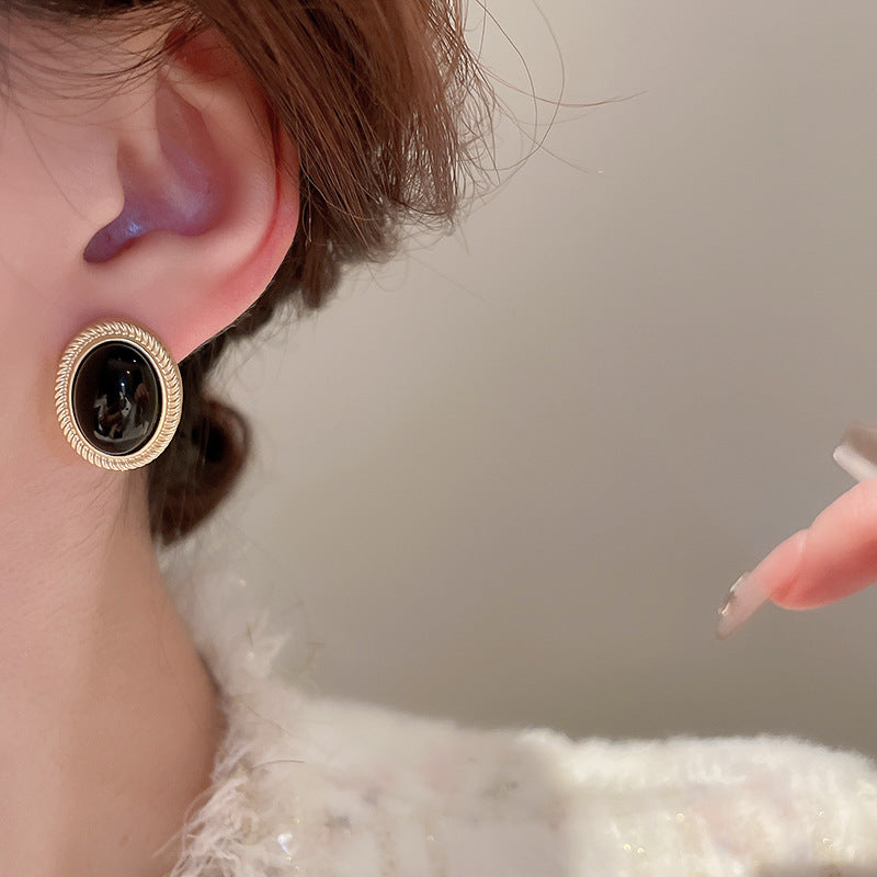 Orecchini a perno in lega con pietra preziosa