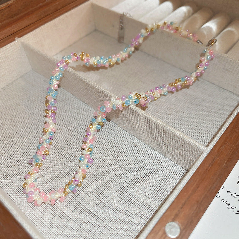 Collana in acciaio con perline di riso