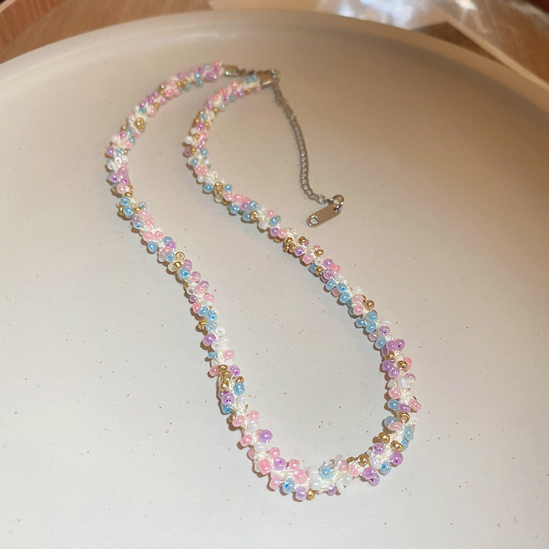 Collana in acciaio con perline di riso