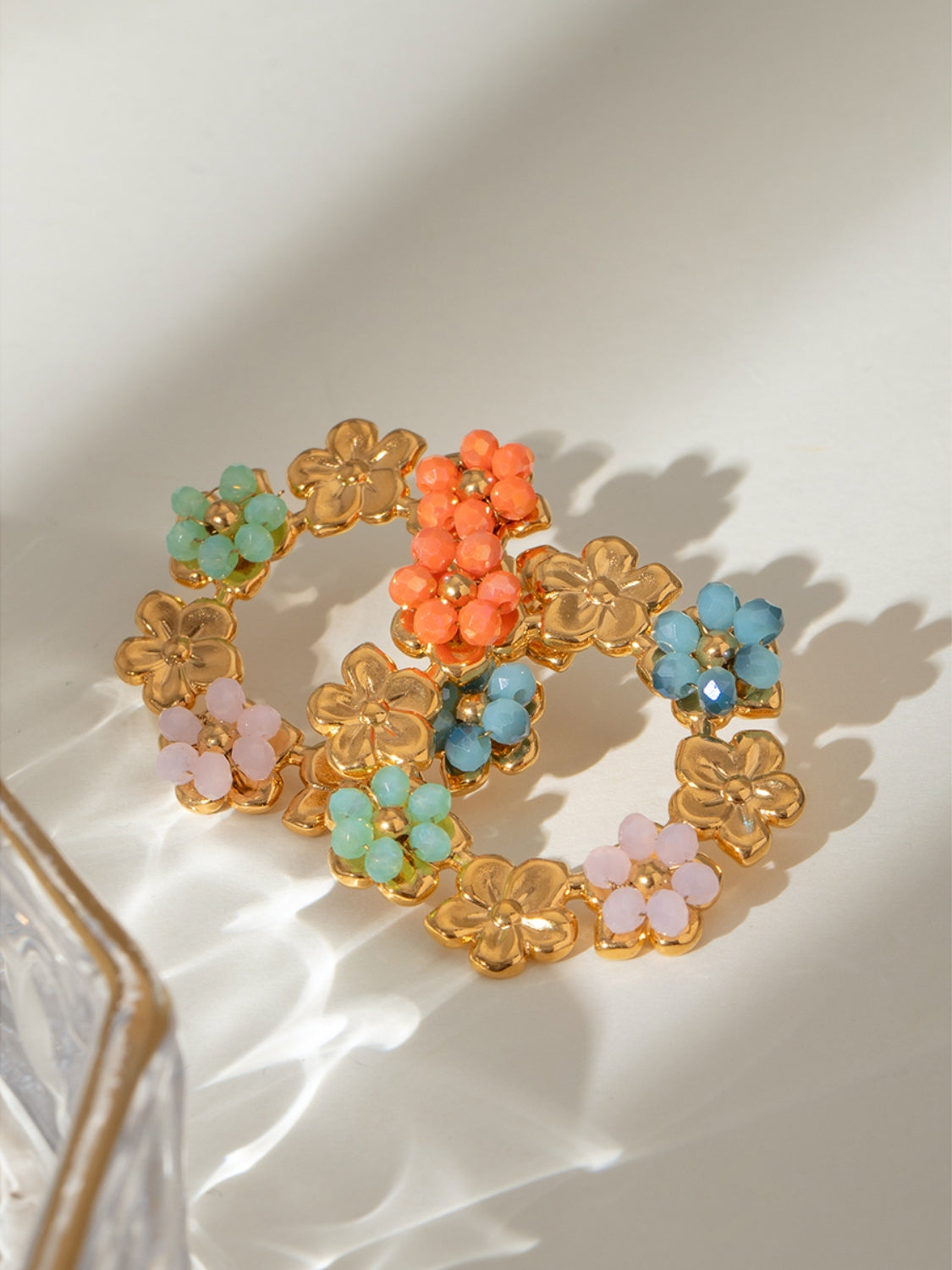 Orecchini a perno in acciaio con cristalli floreali