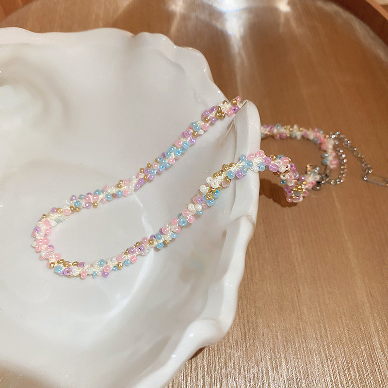 Collana in acciaio con perline di riso