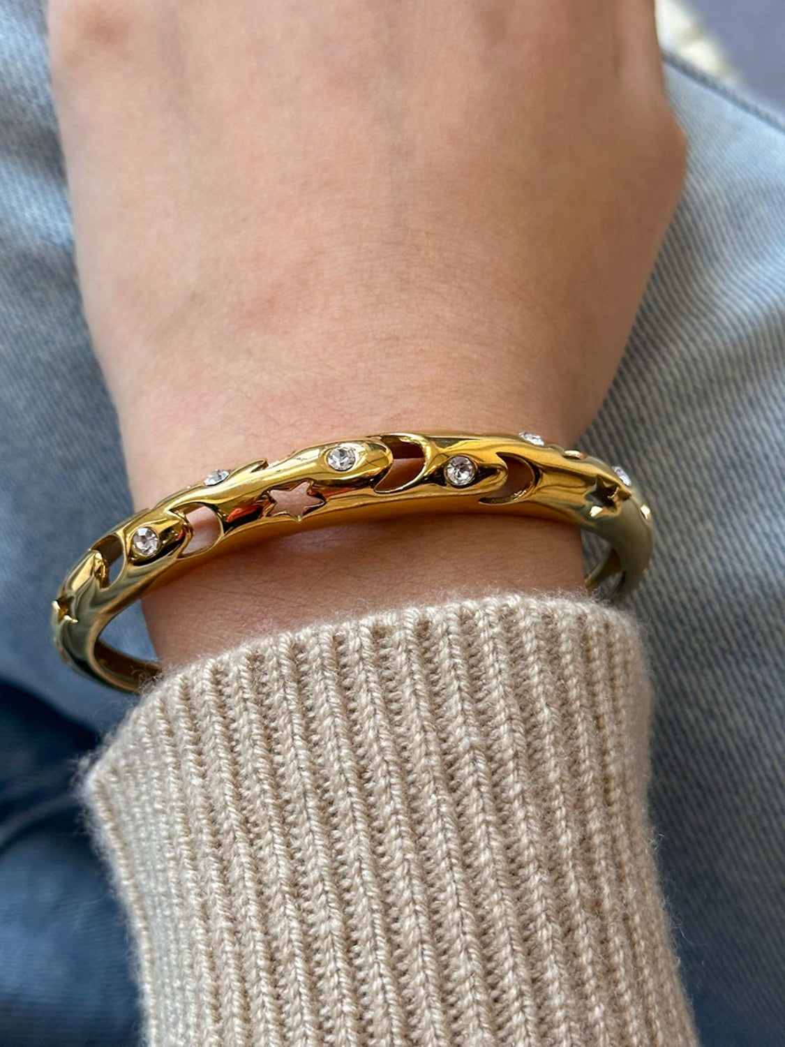 Polsino in acciaio con ritagli e strass